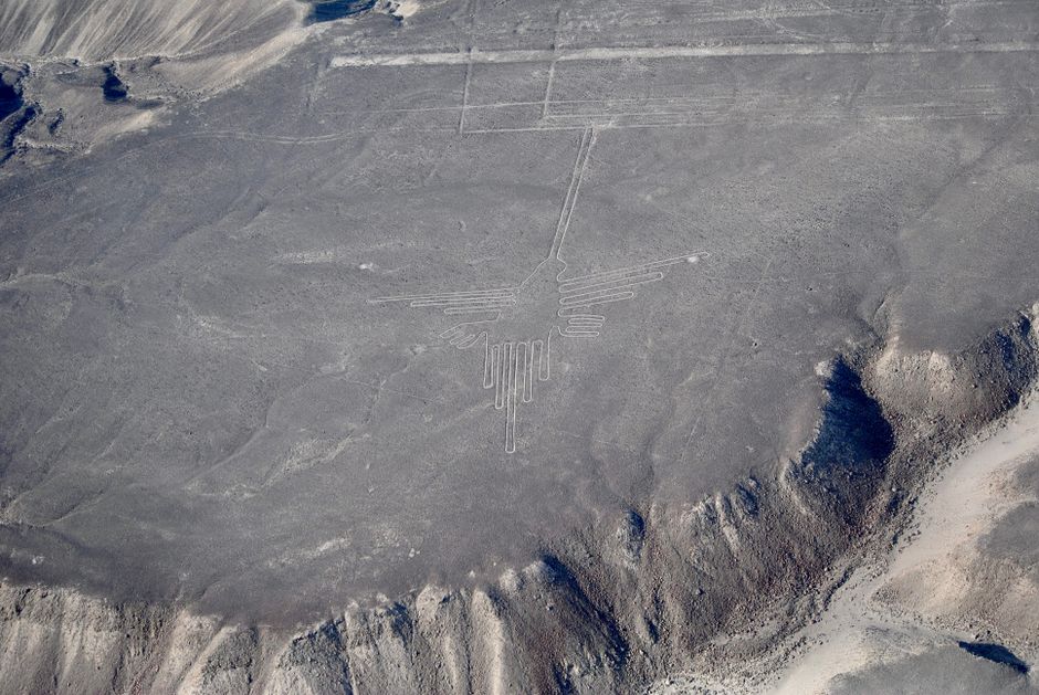 A breathtaking aerial shot of the historic Nazca Lines in the Peruvian desert, depicting ancient geoglyphs.